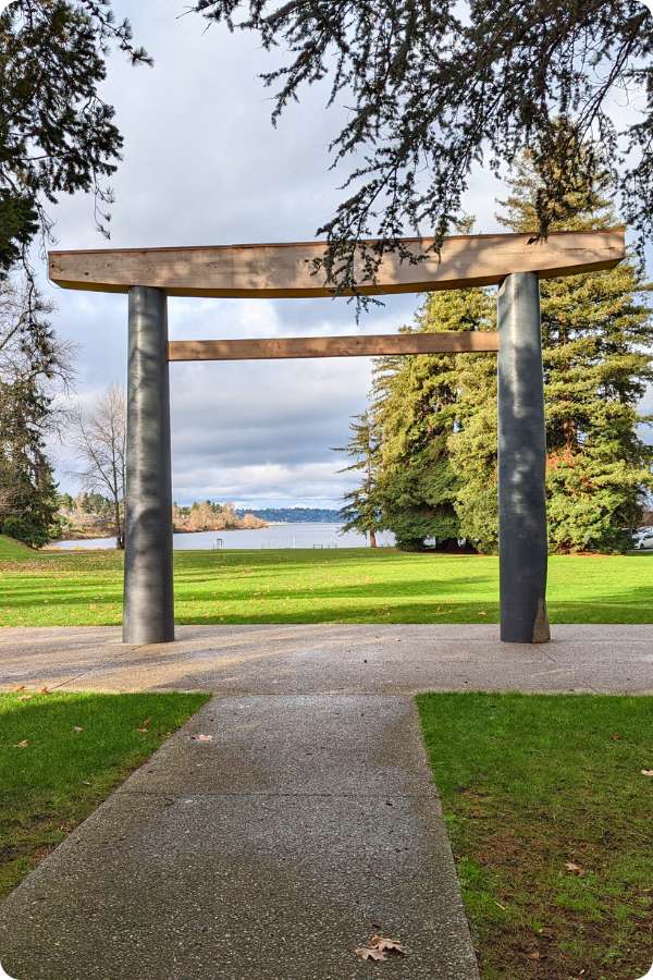 Forested peninsula with beach access and scenic views of Mount Rainier.